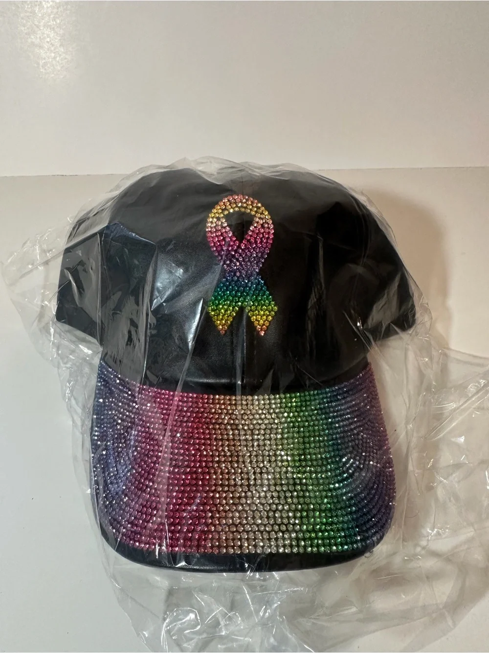 VERA New York Rainbow Rhinestone Awareness Ribbon Faux Leather Hat Black